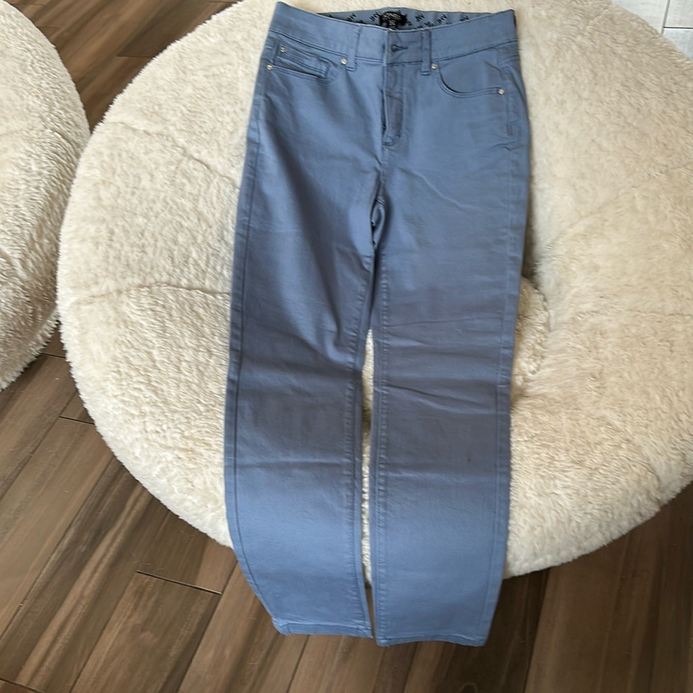 John, New York, size 4 high-rise skinny stretch jeans. In a light blue color.